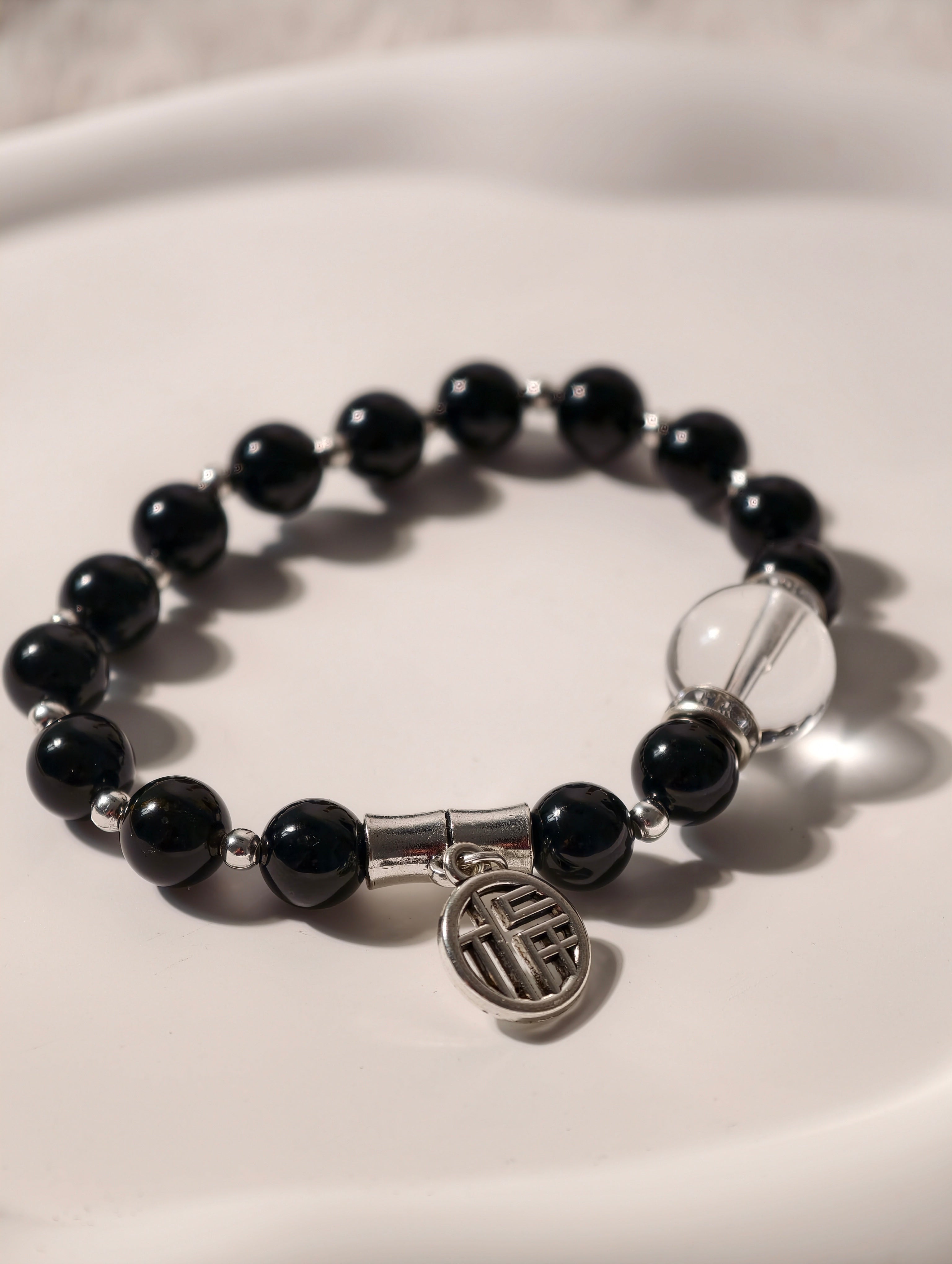 Black Obsidian and Clear Quartz bracelet with silver fortune charm
